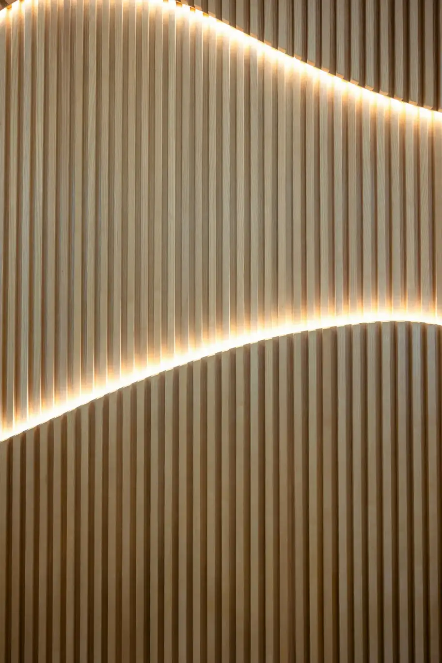Wooden Wave Ceiling with Warm Lighting